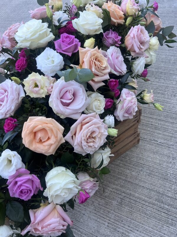 Casket spray funeral flower tribute purple coral