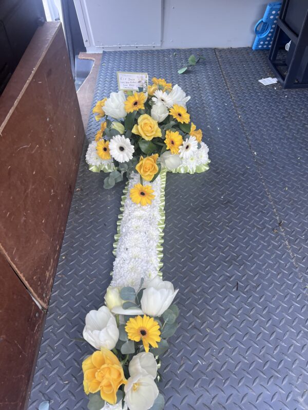 Cross funeral flower tribute yellow