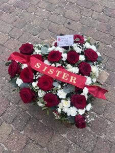 Heart sister funeral flower tribute red roses