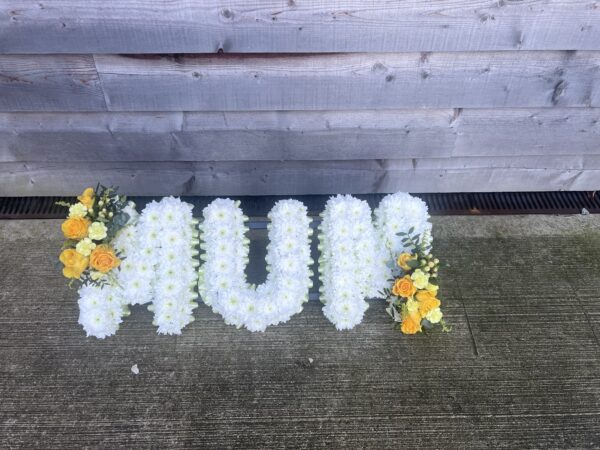 Mum funeral flower tribute yellow