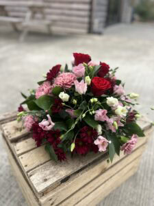 Posy funeral flower tribute red and pink