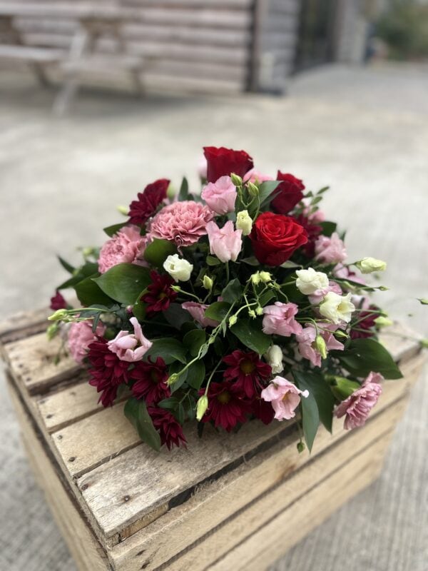 Posy funeral flower tribute red and pink