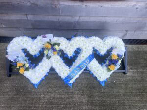Triple hearts funeral flower tribute