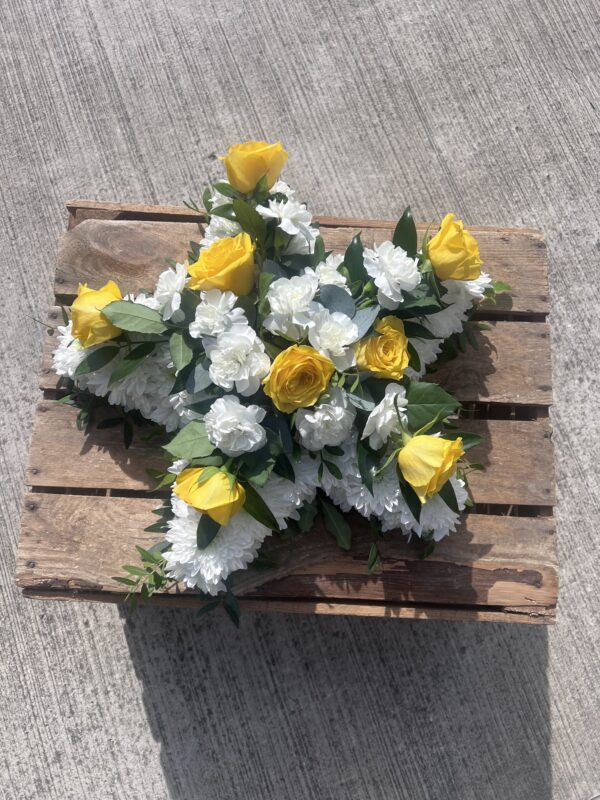 Funeral flower tribute star yellow