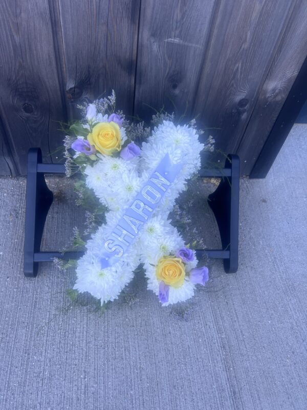 Kiss funeral flower tribute