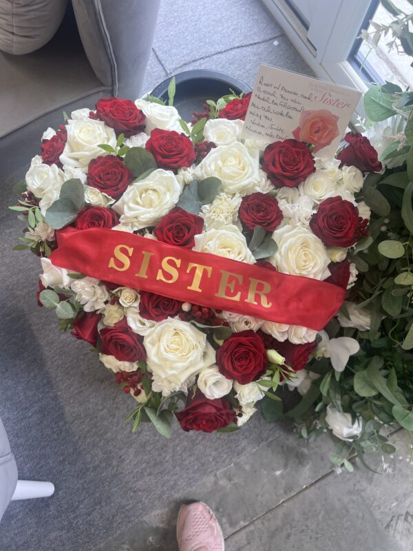 funeral flower tribute heart red roses sister
